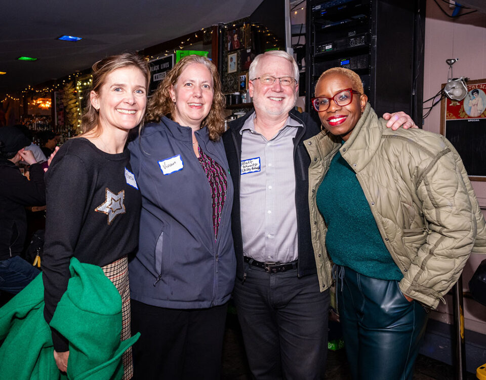 Four Member Party attendees posing for camera