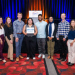 ELPN members posing in a row with NPH podium behind them