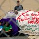 family in a tent asking for affordable housing