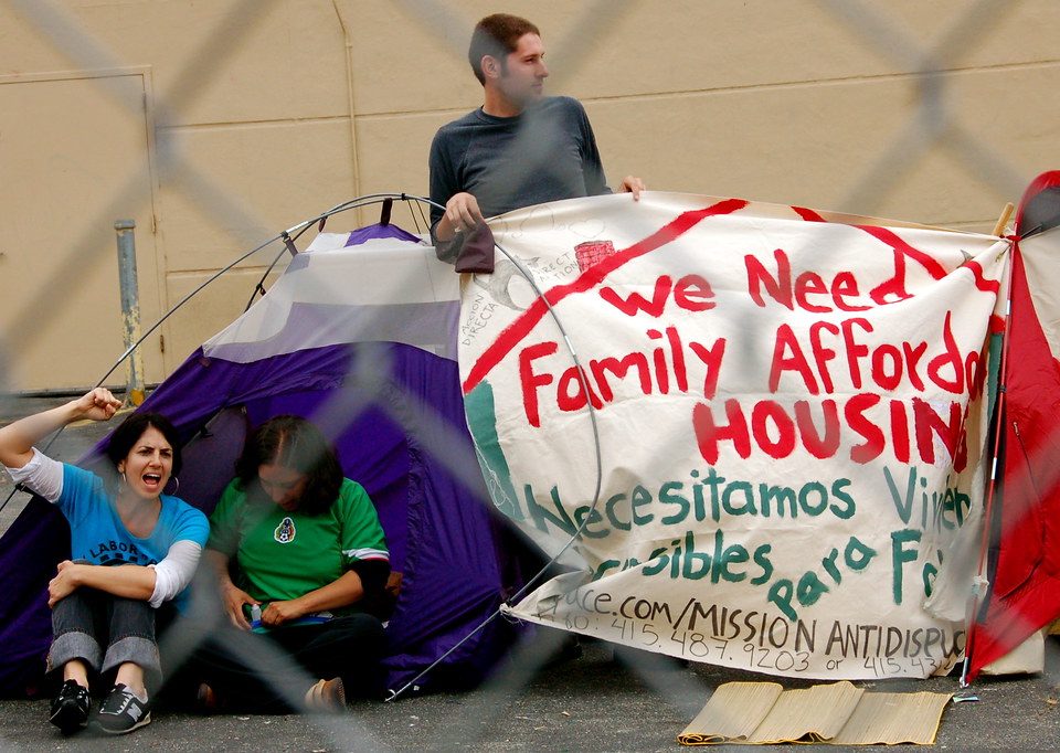 family in a tent asking for affordable housing