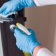 Hands cleaning a door knob
