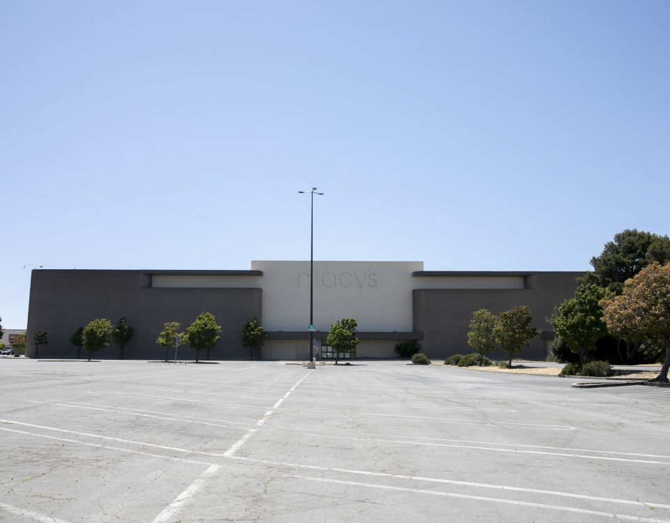 Photo of deserted department store and empty parking lot