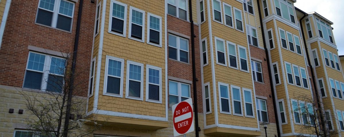 Housing building with "do not enter" sign in front